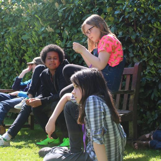 young people relaxing in garden
